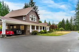 An attached carport offers covered parking for two vehicles.