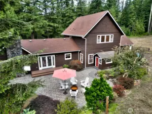 Beautiful paver patio off dining room! Pint sized playhouse is included!