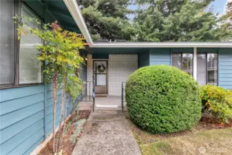 There are gentle stairs to the well landscaped front entrance..