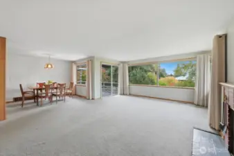 Living room with dining room on left, more built-ins.