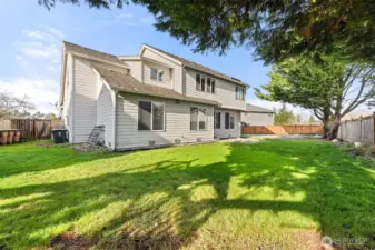 Backyard (has kid's play set behind)