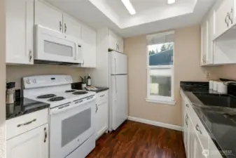 Nice window keeps updated kitchen cheery