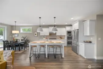 Modern kitchen designed for everyday living and entertaining, featuring island seating, abundant cabinetry, and clean finishes