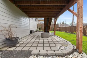 Covered lower patio creates an additional outdoor seating area with year-round usability