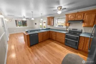 kitchen has great cabinet and storage space and a box window for plants