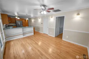 kitchen counter, pull up stools and store games in the open bookcase