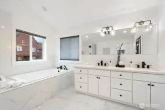 Spa-inspired primary bathroom with extra deep soaking tub and heated floors