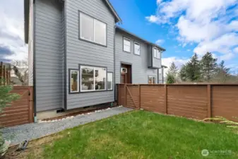 Grassy Fully fenced & gated wrap-around yard excellent for pets and playtime!