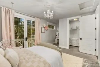 Third bedroom featuring a desk nook and walk in closet on upstairs floor
