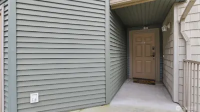 A cozy, tucked-away front entrance creates a warm first impression from the moment you arrive.