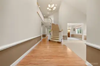 Vaulted ceilings and hardwood floors make for a grand entry