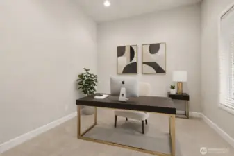 You'll be away from the fray in this spacious office at the front of home with French doors.   Virtual staging