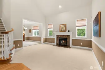 Gather with friends around the cozy gas fireplace in the formal living room