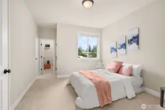 Mother-in-law or guest suite on the main level with walk-in closet and personal bathroom.