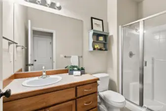 In-law or Guest suite on the main level includes a private bath- Note the easy-access shower.