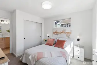 The Primary bedroom is on the upper level off the Great Room. Custom lighting has been installed for bedside reading and blinds have been installed. A sunny & well-appointed room.