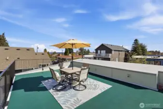 WOW! This memorable rooftop is functional and useable! Notice the custom metal railing for safety. Power and water are available.