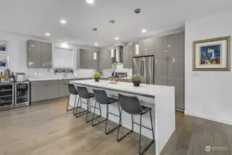 Modern kitchen with SS appliances with potential for a wine-cooler.