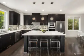 The kitchen is an absolute show-stopper. The oversized island makes a fabulous centerpiece and the breakfast bar is super functional for everyday use.