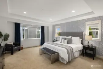The primary bedroom is a dream. Coved ceilings and accent walls set the mood. This space is dialed-in, just like the rest of the home.
