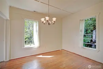 Dining room w/ original wood floors.