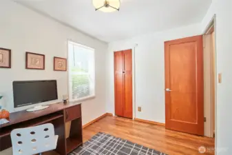Office or bedroom space with lots of natural wood.