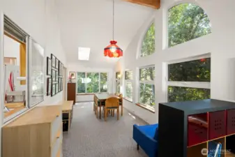 Standing near the far end of the sunroom addition, looking toward the entrance.
