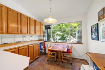 Here is the eating nook at the end of the kitchen, next to the window at the front of the house.
