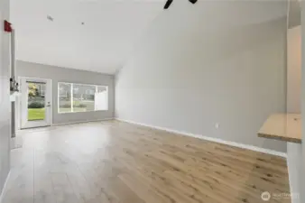 Great room with vaulted ceilings and light