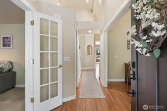 Entry w/ vaulted ceilings and french doors to office