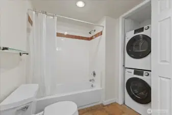ADU Full Bathroom with stacked washer and dryer  laundry units