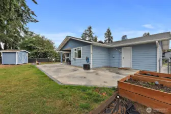 Raised Garden Boxes, Outdoor Shed, Fully Fenced Yard, & Poured Patio on an 8,000 Sq Ft Corner Lot!