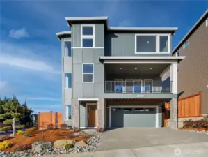 The Glacier Home Plan. All photos, renderings, site maps, and floorplans are for visualization purposes only. Plans, colors, building orientation, finishes, home outlook, and other details can and WILL vary. Striking three-level Glacier plan showcases a modern Craftsman façade with brick accents, vertical siding, and oversized windows for maximum natural light. Covered balcony and welcoming entry set the tone for refined living in Bothell’s Foxmoore community, close to Canyon Park conveniences and I-405 access.