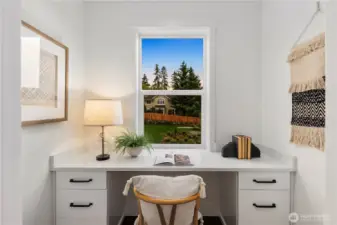 Pocket Office: Light-filled pocket office overlooks the front of the home, creating a peaceful spot for remote work or homework. Built-in desk and storage keep the space functional without interrupting the flow of the main level.    Photos are from THIS model home at Foxmoore but are for visualization purposes only.