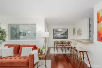 The dedicated dining area is perfectly positioned between kitchen and living room, making dinner parties feel effortless.