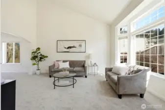 Soaring ceilings and expansive windows fill the home with beautiful natural light and highlight the thoughtful updates throughout.