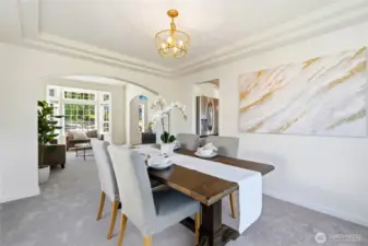 Spacious dining room flows seamlessly into the living room, making it easy to extend the table and host holiday gatherings or dinner parties.