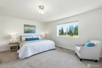 Inviting upstairs primary retreat with serene fairway views of Cedarcrest Golf Course.