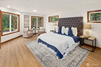 The primary suite is extra spacious with a wonderful sitting area overlooking the backyard.