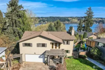 Welcome to this roomy and unique home with endless possibilities - and a lake view!