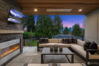 Outdoor covered living area with fireplace