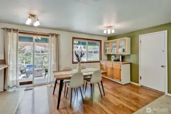 Spacious dining area leading to covered back porch.