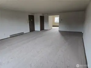 Standing near kitchen.