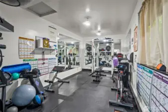 Finished gym inside detached garage.