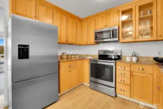 Beautiful Cook's Kitchen Shows Stainless Steel Appliances, Granite Counters & Exceptionally Attractive Shaker Style Cabinetry