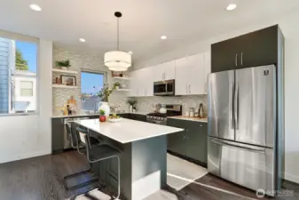 Chef's kitchen includes large island, great for cooking and entertaining.