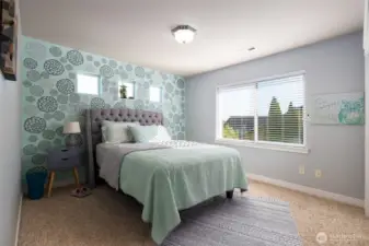 One of two guest bedrooms upstairs, with views of the foothills and Mount Baker.