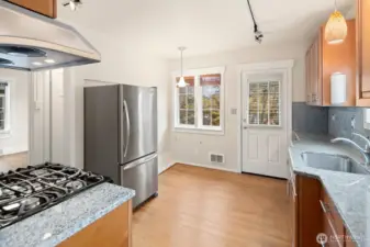 The door leads out to the rear yard and carport.