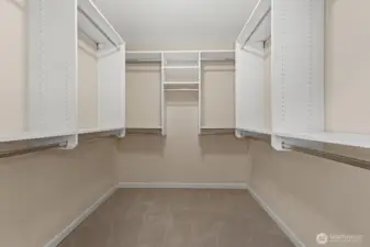 Primary walk-in-closet with plenty of hanging space.