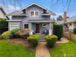 This 1912 N Tacoma Craftsman has curb appeal that will draw you in and make you want to stay for a while!
